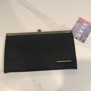 Roxy clutch with tags